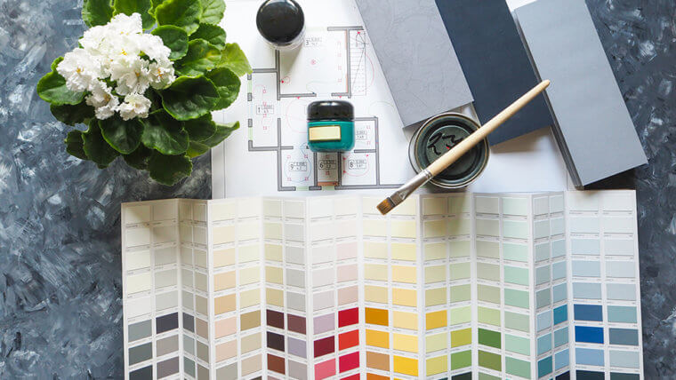 Photo of paint samples and blueprint for How To Customize Your Home Blog